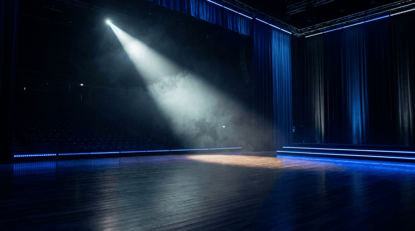 A dramatic single spotlight on a dark premium arena stage with haze.